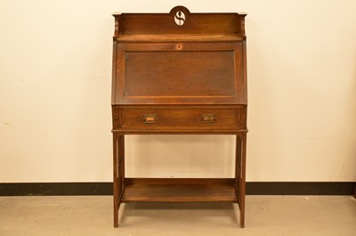 Lot 415 - An early 20th century oak arts and crafts bureau