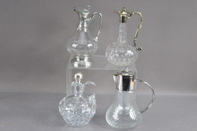 Lot 222 - Four various claret or wine jugs