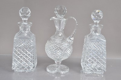 Lot 232 - A high quality lead crystal claret jug and a pair of  cut crystal whisky or liqueur decanters