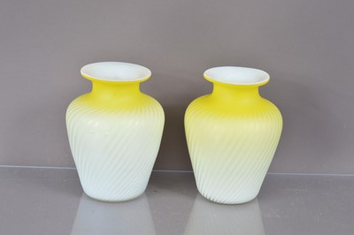 Lot 269 - A pair of Victorian canary yellow and white satin glass "Pompeian Swirl" air trap vases