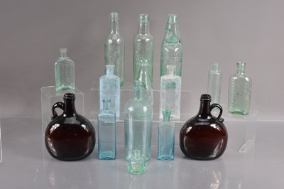 Lot 306 - A collection of fifteen antique moulded glass bottles