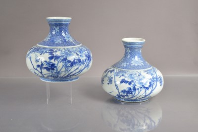 Lot 332 - A pair of 19th Century Japanese blue and white Seto or Arita squat-shaped vases