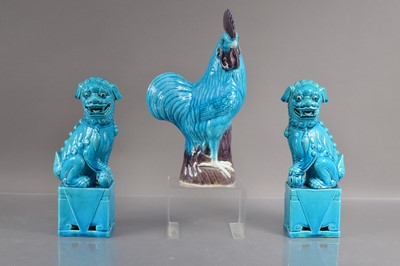 Lot 339 - A pair of Chinese turquise glazed moulded posrcelain foo dogs or guardian lions
