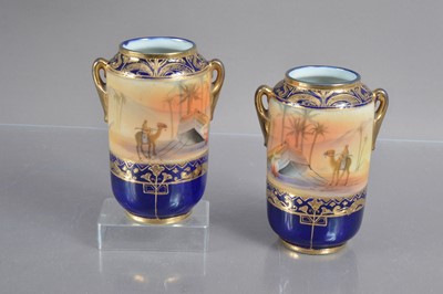 Lot 343 - An interesting pair of Taisho period Noritake 'Orientalist' vases