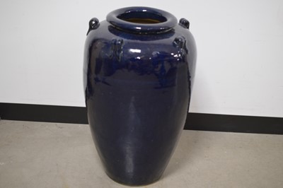 Lot 354 - A large aubergine glazed 'Ali-Baba' or 'Snake Charmer' shape jar