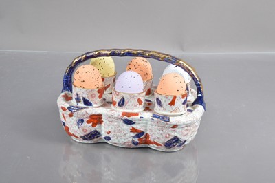 Lot 359 - A Victorian Staffordshire pottery egg cup basket