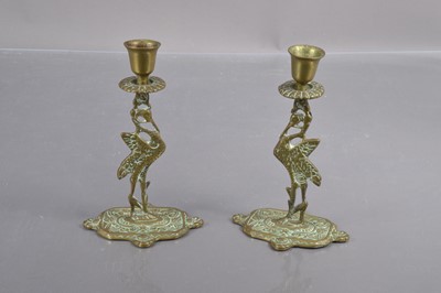 Lot 360 - A pair of early 20th Century brass 'Liverbird' candlesticks