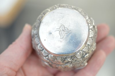 Lot 366 - A small Burmese repoussé metalwork 'thabeik' bowl