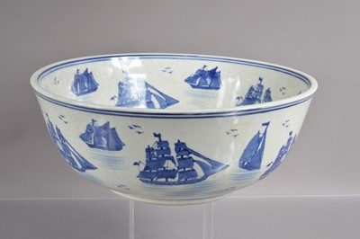 Lot 397 - A large blue and white crackle glazed punch or fruit bowl decorated with sailing ships