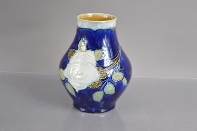 Lot 424 - A Royal Doulton Art Nouveau vase decorated with white roses circa 1900