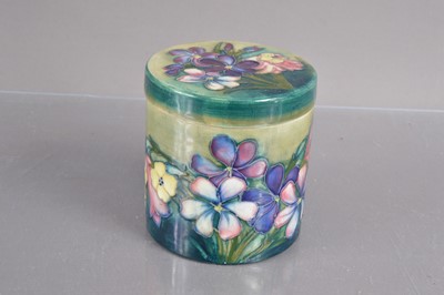 Lot 432 - A Moorcroft lidded jar in 'Freesia' pattern circa 1930