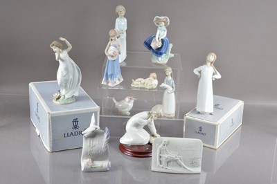 Lot 439 - A group of nine Lladro figures and models and two collector's plaques