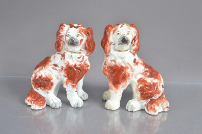 Lot 443 - A good pair of small-sized antique Staffordshire pottery spaniel dogs