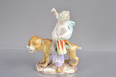 Lot 448 - A Meissen porcelain figure group modelled as a young faun with drum riding a lioness.