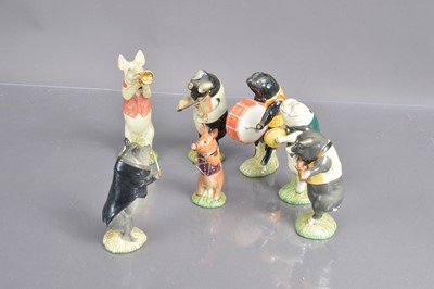 Lot 454 - A set of seven Bewsick 'Pig Band' figurines