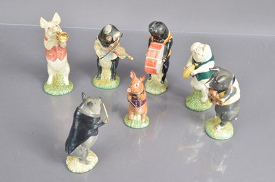 Lot 454 - A set of seven Bewsick 'Pig Band' figurines