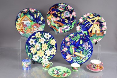 Lot 484 - A scarce set of five Maling art pottery plates with raised relief designs