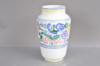 Lot 499 - A Poole Pottery vase hand-painted with flowers and birds