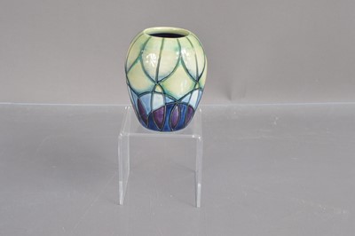 Lot 523 - A small Moorcroft pottery vase in 'Indigo' pattern