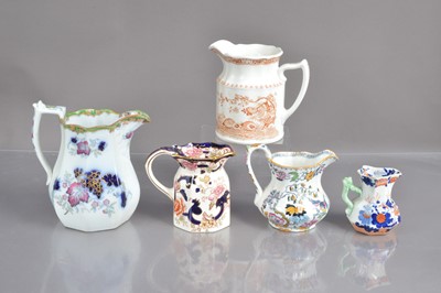 Lot 535 - A graduated collection of various graduated jugs