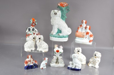 Lot 552 - Thirteen various Staffordshire style dogs