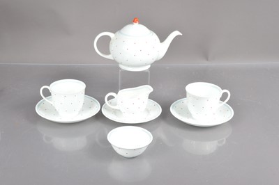 Lot 557 - A Susie Cooper polkadot pattern bone china two-person teaset