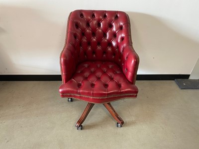 Lot 366 - A c1980s red leather upholstered swivel office chair