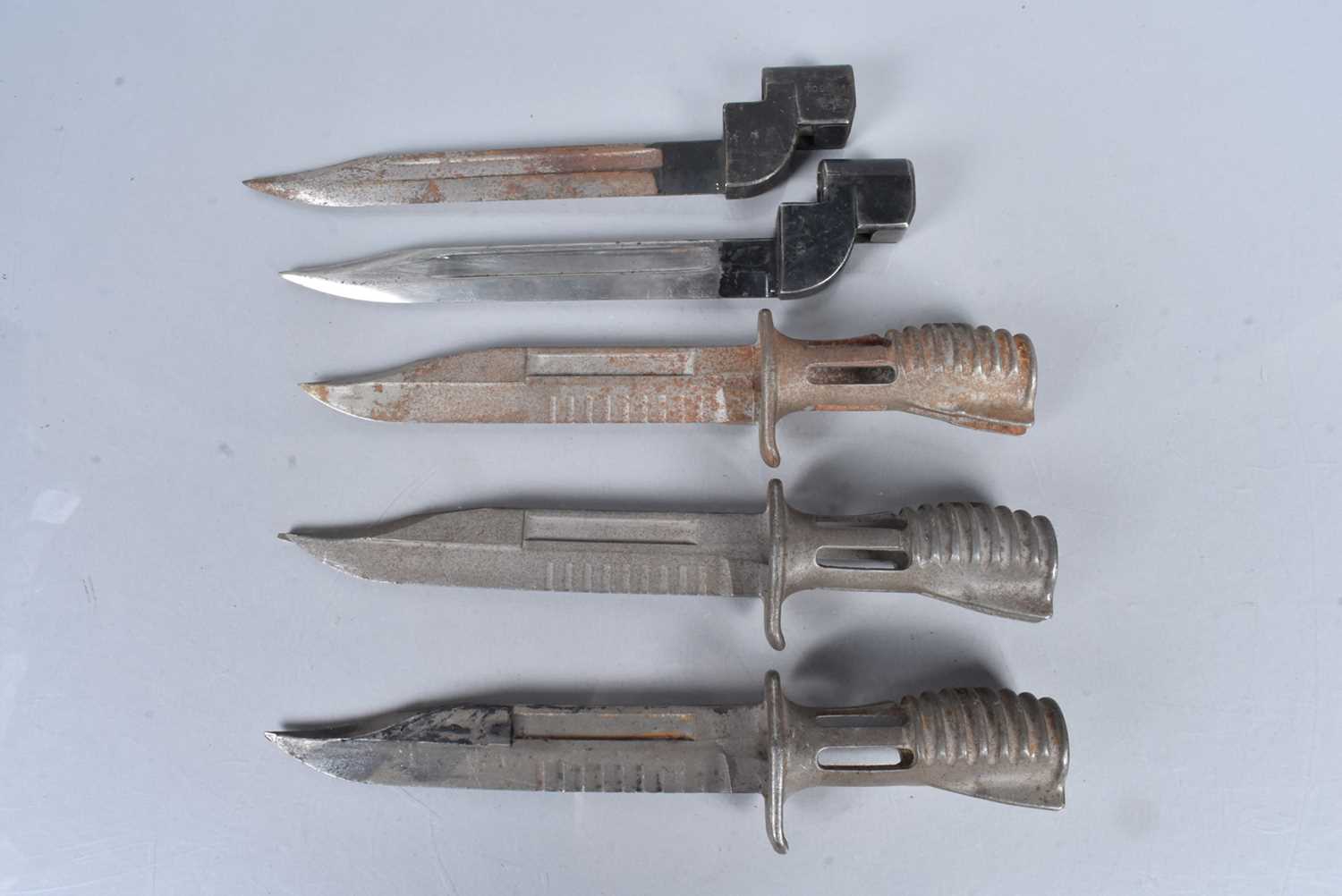 Lot 910 - Three SA80 bayonets