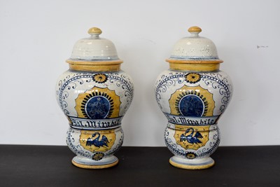 Lot 129 - A pair of 20th Century Pharmacy lidded jars
