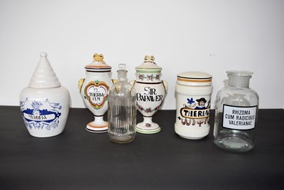 Lot 147 - A group of four stoneware Pharmacist's containers
