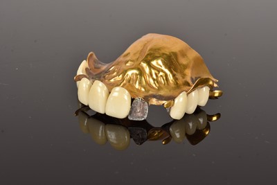 Lot 202 - A late 18th Century gold and walrus ivory partial lower denture