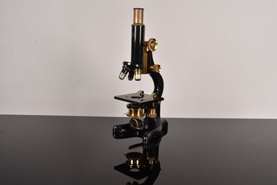 Lot 256 - A vintage Dollond of London brass and black lacquered microscope