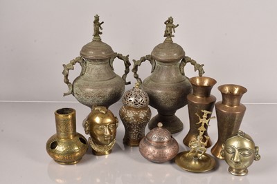 Lot 347 - A pair of Middle Eastern metal lidded urns