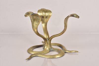 Lot 348 - A Benares brass figure of three cobras