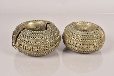 Lot 353 - A pair of African Currency Bangles/Bracelets