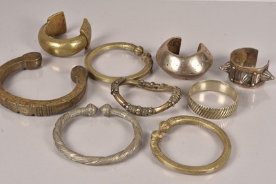 Lot 354 - A collection of Currency Bangles/Bracelets