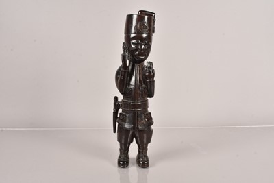 Lot 386 - An African carved wooden Authority Figure