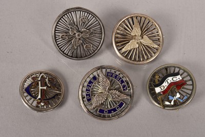 Lot 515 - A group of five white metal cycling badges