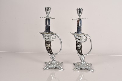 Lot 686 - A pair of novelty German Sword hilt candlesticks