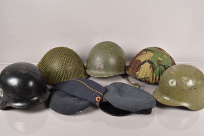 Lot 710 - A collection of World Helmets and Caps