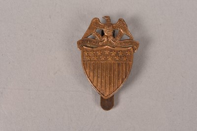 Lot 715 - A WWI US Army Field Cap badge