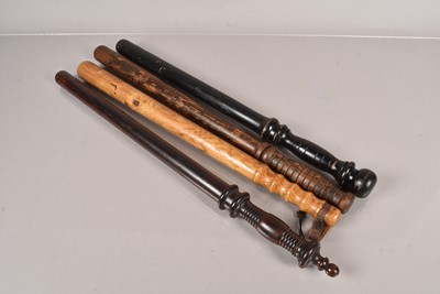 Lot 816 - A group of four long wooden truncheons/bludgeons