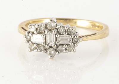 Lot 102 - An 18ct gold diamond three stone cluster ring