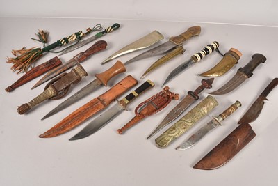 Lot 947 - An assortment of Middle Eastern knives and daggers