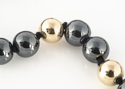 Lot 107 - A haematite and 9ct gold bead necklace