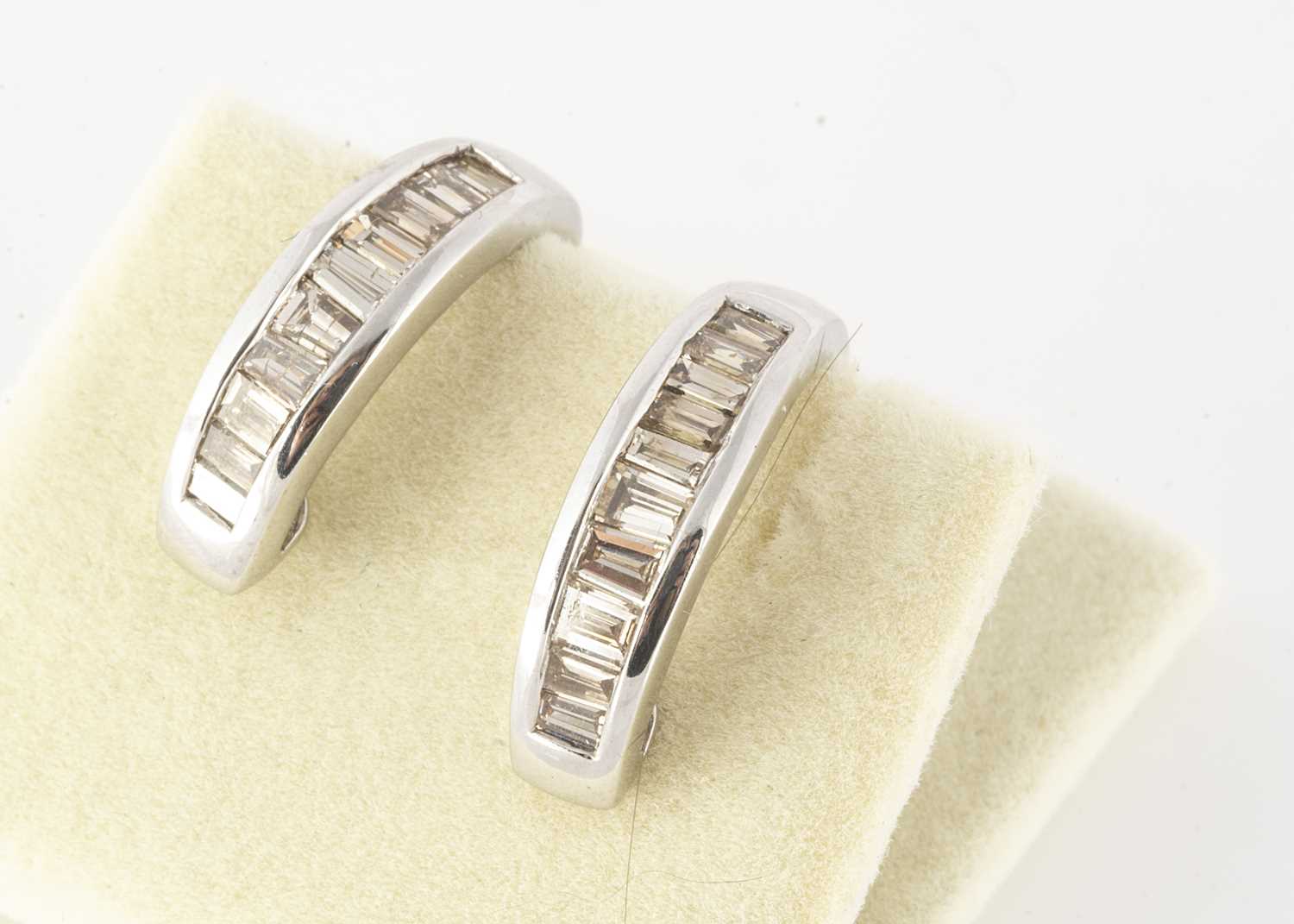 Lot 108 - A pair of 18ct white metal gold cuff earrings