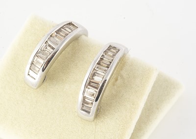 Lot 108 - A pair of 18ct white metal gold cuff earrings