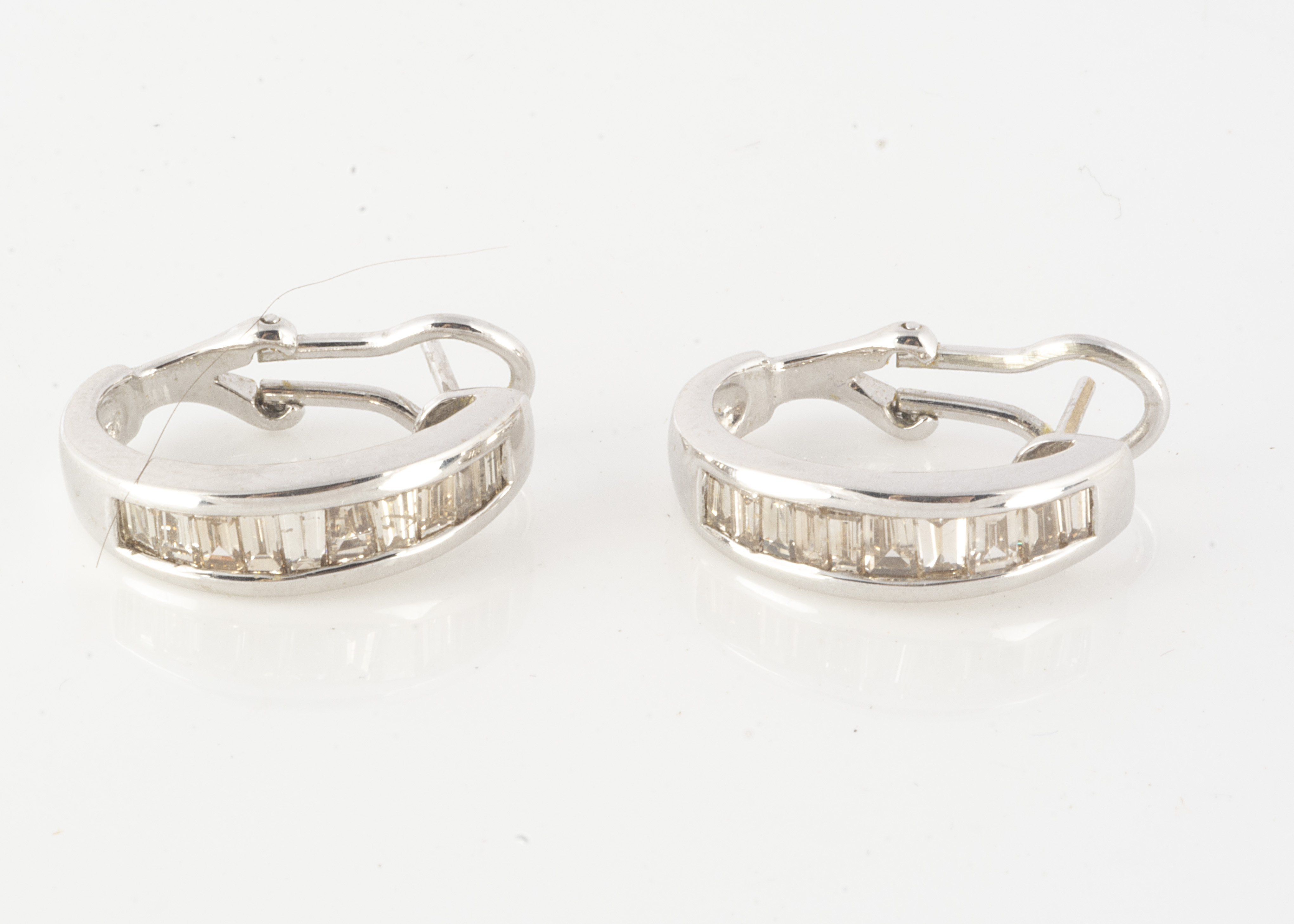Lot 108 A pair of 18ct white metal gold cuff