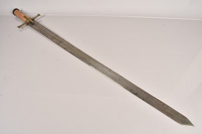 Lot 1017 - A large wooden handled broad sword