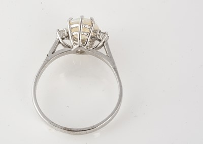Lot 112 - An 18ct gold three stone opal and diamond dress ring